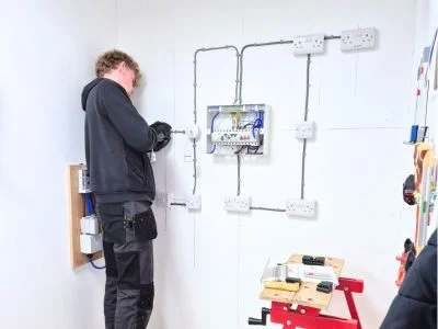 Elec Training Learner working on consumer unit